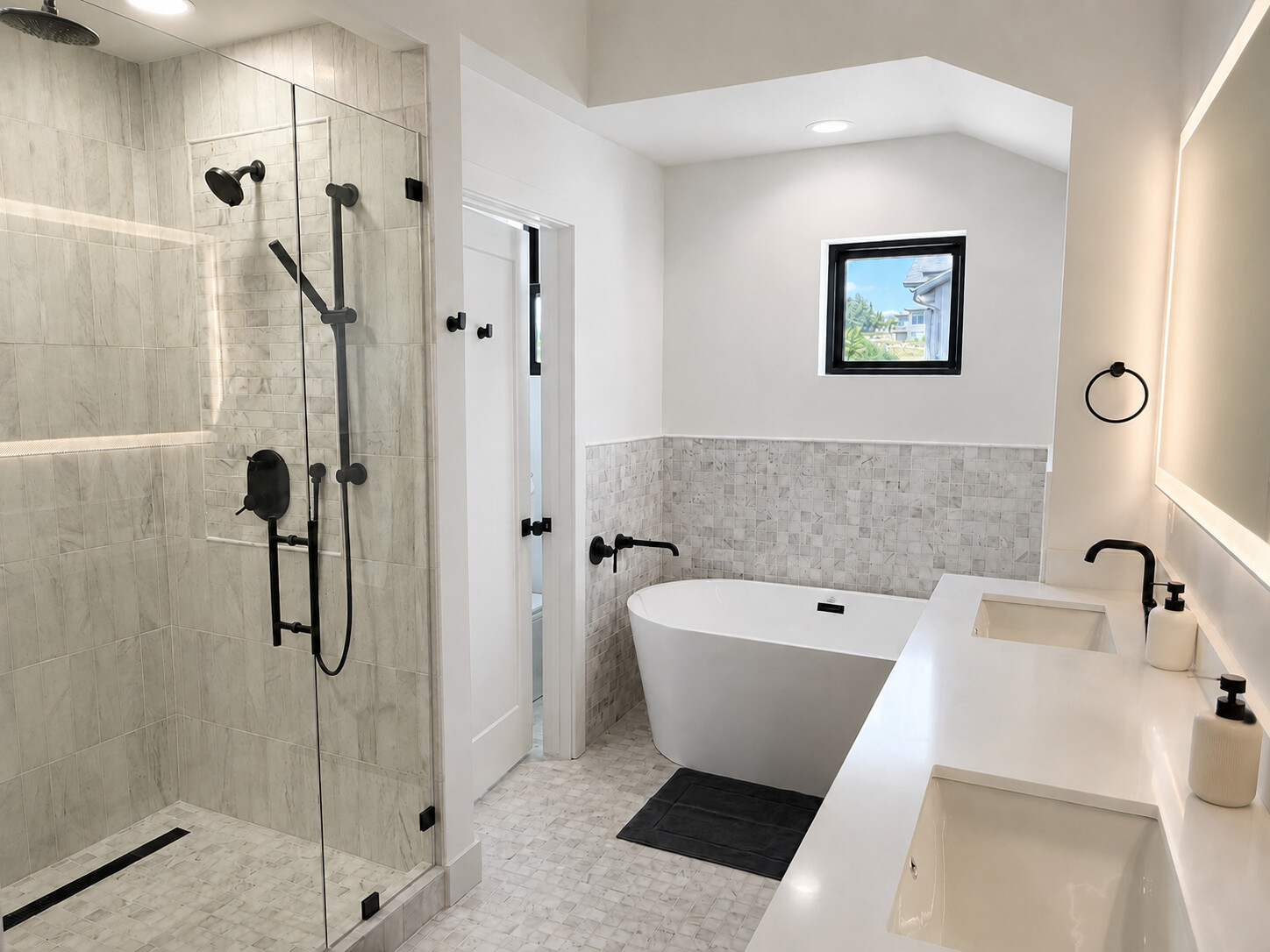 Primary bathroom with a glass shower, freestanding tub, and double vanity